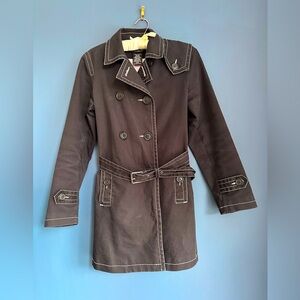 Classic black trench with white stitching and inside pink pinstripe lining.